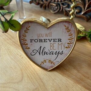 A heart-shaped plaque is a sentimental decorative item Gold and Pink